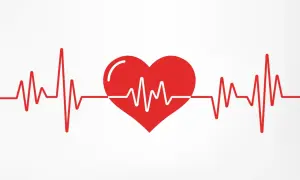 Czerwone serce z linią EKG na białym tle.
