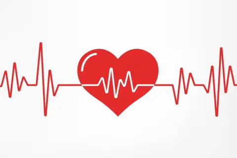 Czerwone serce z linią EKG, symbolizujące zdrowe, choć czasem wysokie tętno.